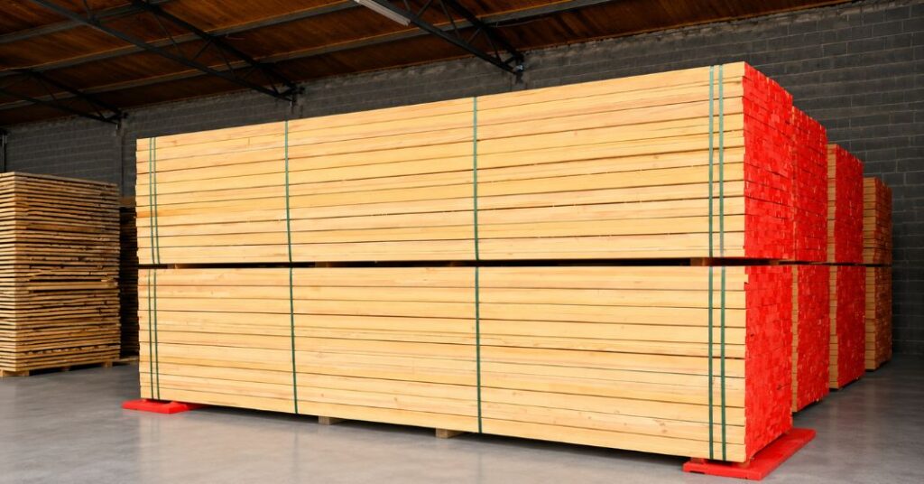 Whitewood timber planks stacked in a UAE building materials warehouse